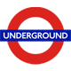 White tube icon on green roundel